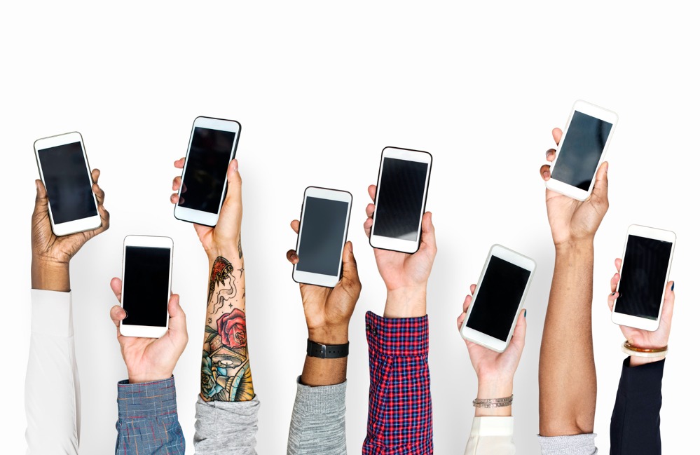 hand-holding-mobile-phones-isolated.jpg